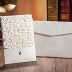 Hosmsua 50PCS White Wedding Invitations Kit 5 x 7.3 Inch Laser Cut Hollow Rose Rhinestone Pocket with Envelope for Quinceanera Bridal Shower Invite (White Ivory)