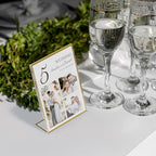 NIUBEE 6 Pack 5 x 7 Acrylic Gold Frame, Slanted Back Table Sign Holder for Wedding Table Numbers, Restaurant Signs, Photos and Art Display Visit the Store